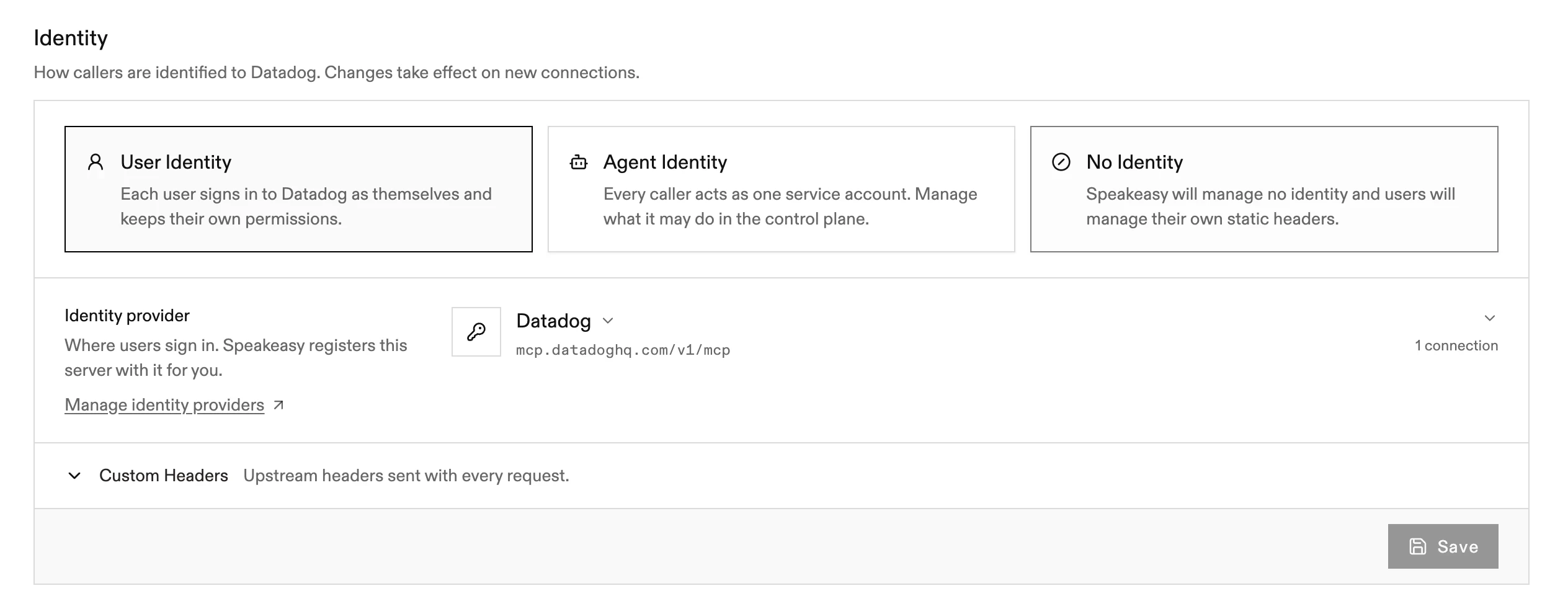 The Identity section of a remote MCP server for Datadog, with the User Identity, Agent Identity, and No Identity options, the Identity provider picker with a Manage identity providers link, and the collapsed Custom Headers row