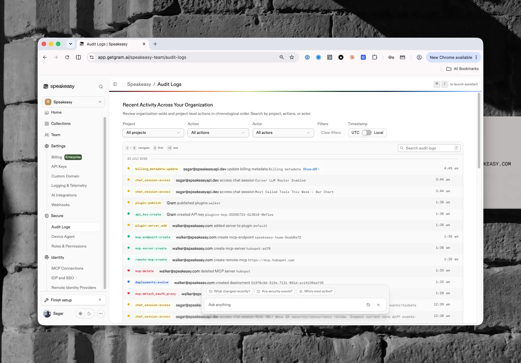 The audit log feed with action badges, actors, diffs, filters, and the assistant prompt